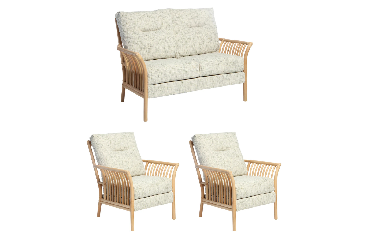 Wicker outdoor furniture set with cushions on a white background